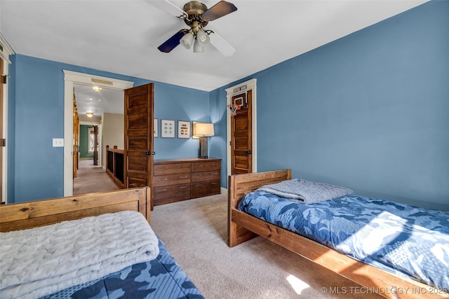 carpeted bedroom with a ceiling fan