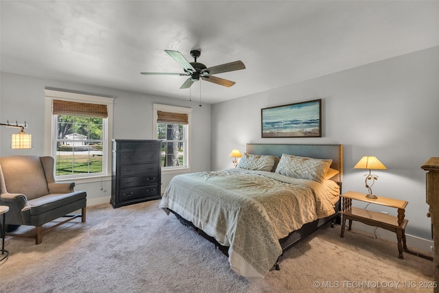 bedroom featuring carpet flooring, baseboards, and ceiling fan