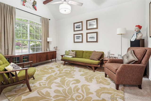 living room with ceiling fan, light colored carpet, and high vaulted ceiling