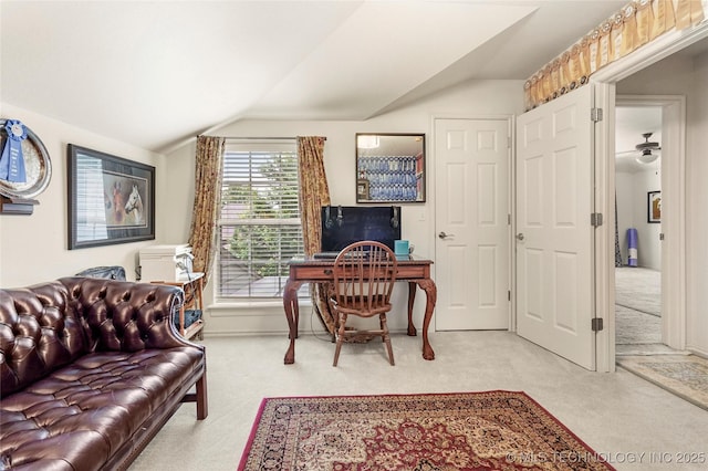 office featuring light carpet and vaulted ceiling
