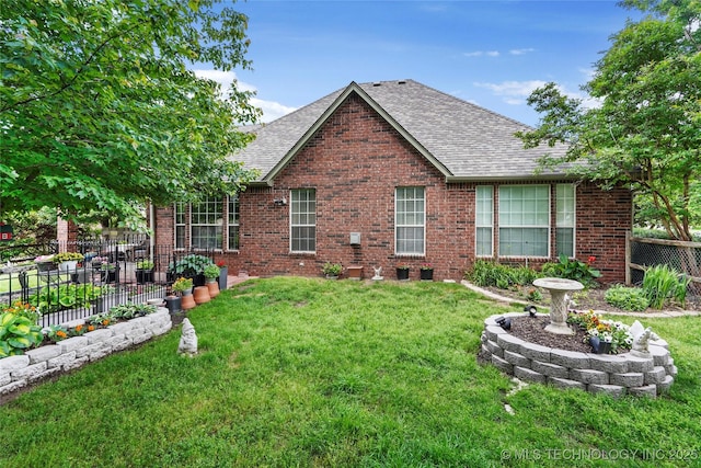 rear view of property with roof with shingles and brick siding