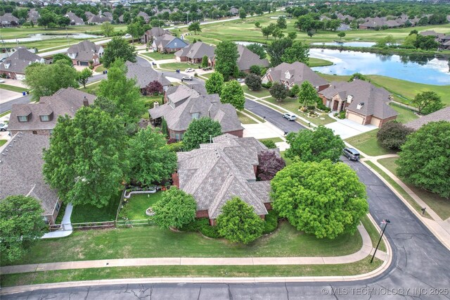 aerial perspective of suburban area with a large body of water