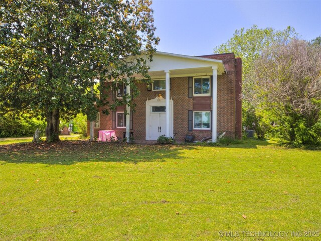 2831 S 24th St W, Muskogee, OK 74401 - greek revival house with a front yard and brick siding