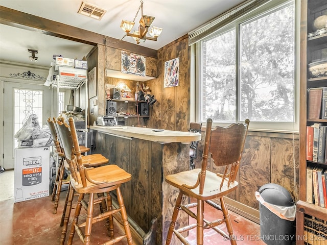 2831 S 24th St W, Muskogee, OK 74401 - indoor dry bar featuring concrete flooring and a chandelier