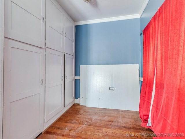 2831 S 24th St W, Muskogee, OK 74401 - unfurnished bedroom with wood finished floors and ornamental molding