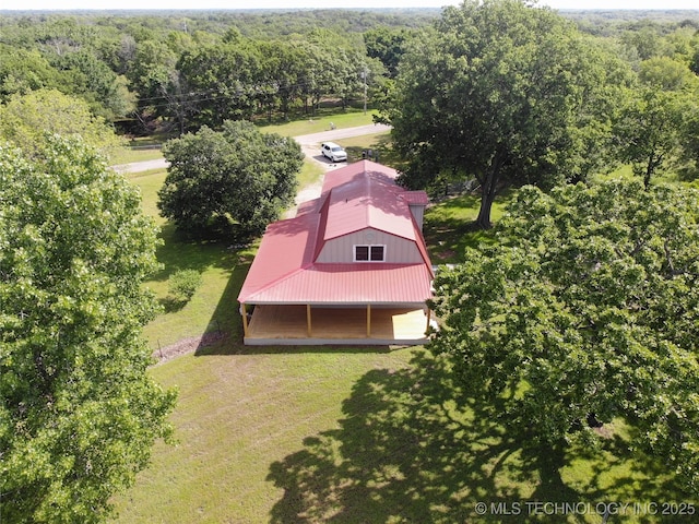 401051 W 2480th Rd, Bartlesville, OK 74006 - view from above of property featuring a heavily wooded area