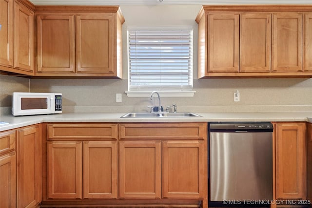 1601 S 165th W Ave, Sand Springs, OK 74063 - kitchen featuring dishwasher, white microwave, light countertops, and brown cabinets
