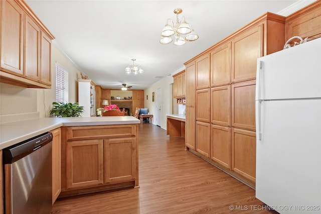 1601 S 165th W Ave, Sand Springs, OK 74063 - kitchen featuring freestanding refrigerator, stainless steel dishwasher, a chandelier, a peninsula, and a fireplace