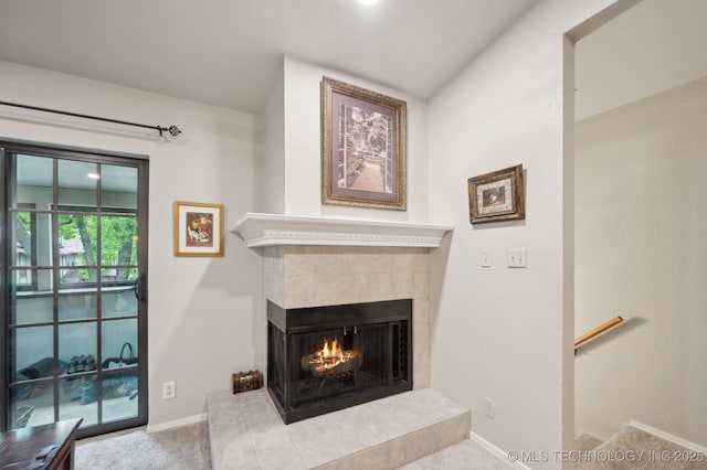 6522 S Memorial Dr Unit 19-H, Tulsa, OK 74133 - living room with a tile fireplace, carpet floors, and baseboards