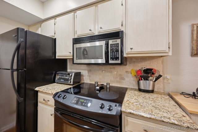 6522 S Memorial Dr Unit 19-H, Tulsa, OK 74133 - kitchen featuring black appliances and tasteful backsplash