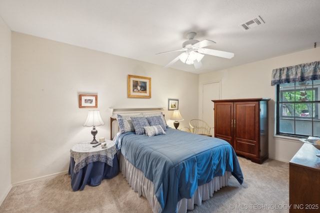 6522 S Memorial Dr Unit 19-H, Tulsa, OK 74133 - bedroom with light colored carpet, baseboards, and ceiling fan