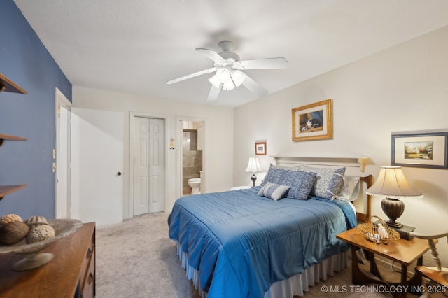 6522 S Memorial Dr Unit 19-H, Tulsa, OK 74133 - carpeted bedroom with a closet, ensuite bathroom, and ceiling fan
