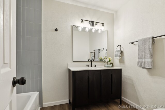 1901 W Indianola St, Broken Arrow, OK 74012 - full bath featuring vanity, wood finished floors, shower / tub combination, and baseboards