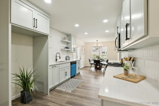 1901 W Indianola St, Broken Arrow, OK 74012 - kitchen featuring dishwashing machine, a sink, light wood-style floors, recessed lighting, and light countertops