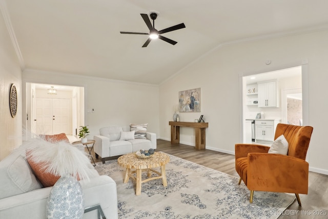 1901 W Indianola St, Broken Arrow, OK 74012 - living area featuring a ceiling fan, light wood finished floors, ornamental molding, vaulted ceiling, and baseboards