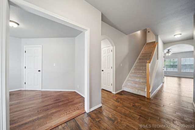 4025 S 217th E Ave, Broken Arrow, OK 74014 - stairs with arched walkways, hardwood / wood-style flooring, ceiling fan, and baseboards