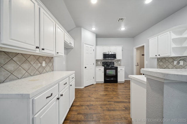 4025 S 217th E Ave, Broken Arrow, OK 74014 - kitchen featuring black range with electric cooktop, stainless steel microwave, open shelves, decorative backsplash, and dark wood finished floors