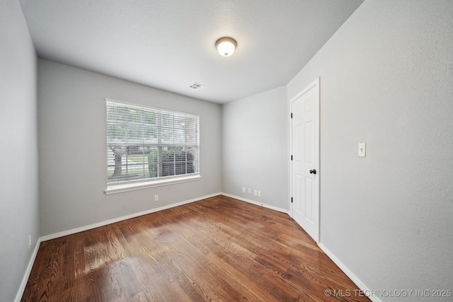 4025 S 217th E Ave, Broken Arrow, OK 74014 - empty room featuring wood finished floors and baseboards