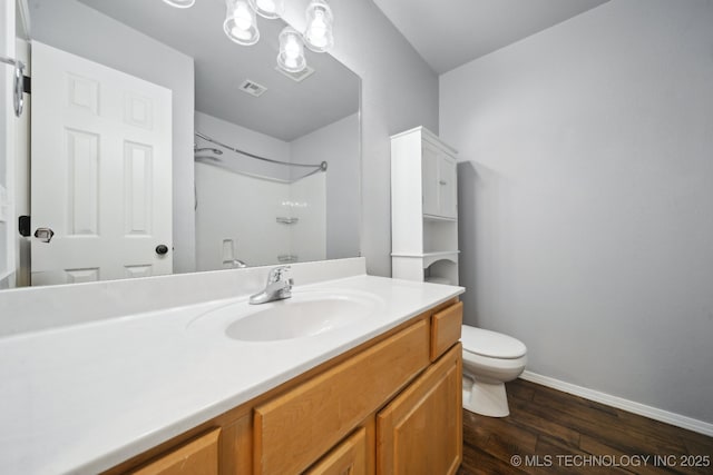 4025 S 217th E Ave, Broken Arrow, OK 74014 - bathroom with wood finished floors, toilet, vanity, a shower, and baseboards