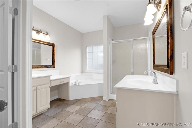 bathroom featuring a stall shower, a garden tub, vanity, and tile patterned flooring
