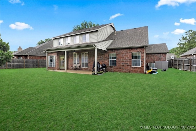 back of house with brick siding, a patio, central AC, and a shingled roof