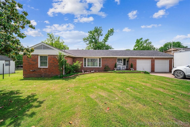 ranch-style house featuring a garage, brick siding, concrete driveway, and a front yard