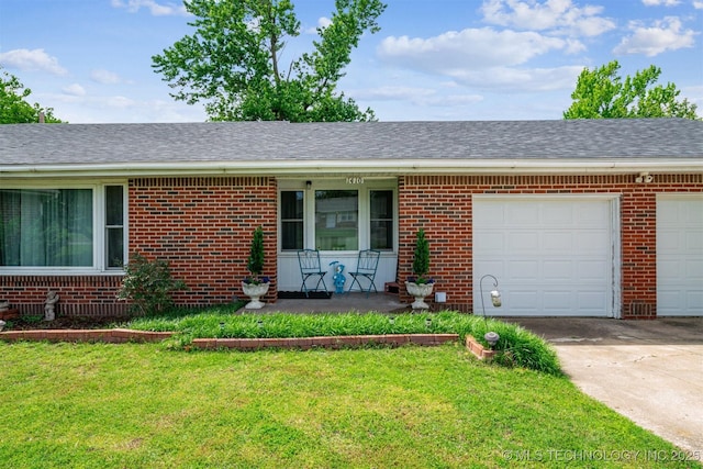 ranch-style home featuring brick siding, concrete driveway, a garage, and a front lawn