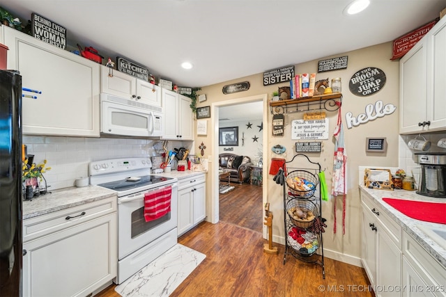 kitchen featuring white appliances, wood finished floors, backsplash, and recessed lighting