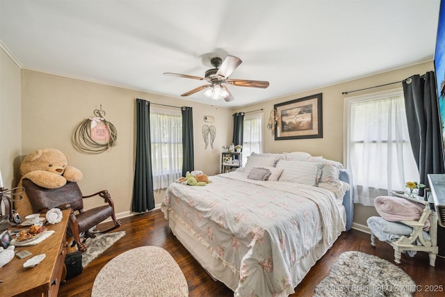 bedroom featuring dark wood-type flooring, baseboards, and a ceiling fan