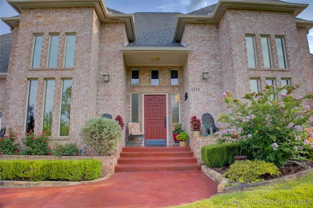 1310 N Northridge Ct, Sand Springs, OK 74063 - doorway to property featuring brick siding and a shingled roof