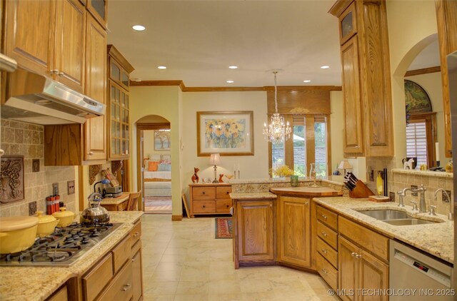 1310 N Northridge Ct, Sand Springs, OK 74063 - kitchen with arched walkways, dishwashing machine, a sink, stainless steel gas stovetop, and tasteful backsplash