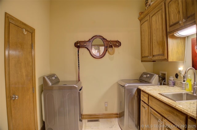 1310 N Northridge Ct, Sand Springs, OK 74063 - laundry room with separate washer and dryer, cabinet space, and baseboards