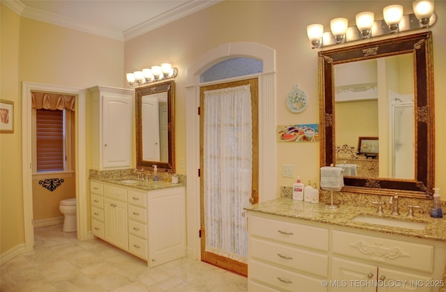1310 N Northridge Ct, Sand Springs, OK 74063 - full bath with crown molding, toilet, two vanities, and baseboards