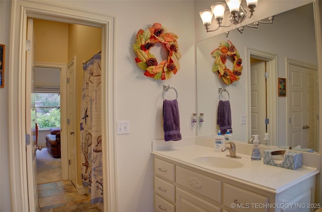 1310 N Northridge Ct, Sand Springs, OK 74063 - bathroom with a chandelier and vanity