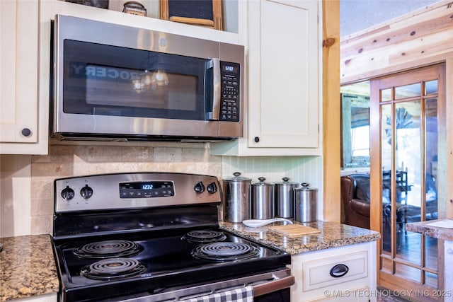 5700 S Wiley Rd, Milburn, OK 73450 - kitchen with stainless steel appliances, white cabinets, decorative backsplash, and light stone countertops
