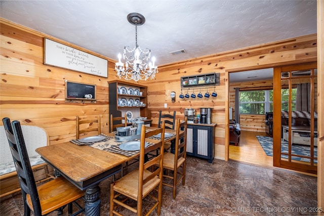 5700 S Wiley Rd, Milburn, OK 73450 - dining room with wood walls and a chandelier