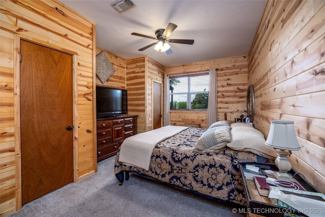 5700 S Wiley Rd, Milburn, OK 73450 - bedroom featuring carpet, wood walls, and a ceiling fan