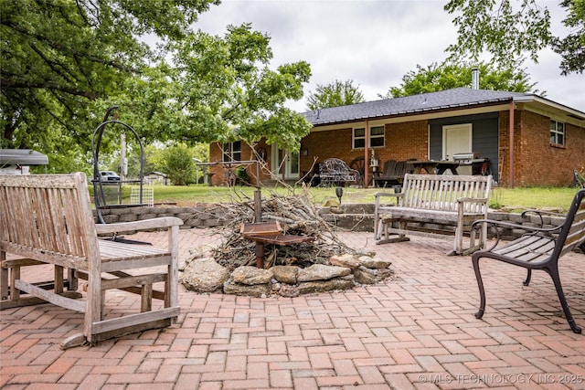 5700 S Wiley Rd, Milburn, OK 73450 - view of patio featuring a fire pit