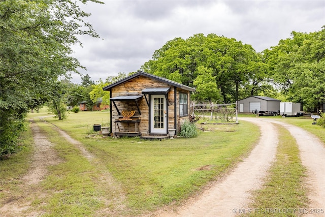 5700 S Wiley Rd, Milburn, OK 73450 - view of outdoor structure featuring dirt driveway and an outbuilding