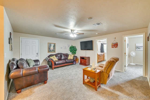 1694 Boat Ramp Rd, Kingston, OK 73439 - living room with carpet flooring, a textured ceiling, a ceiling fan, and baseboards