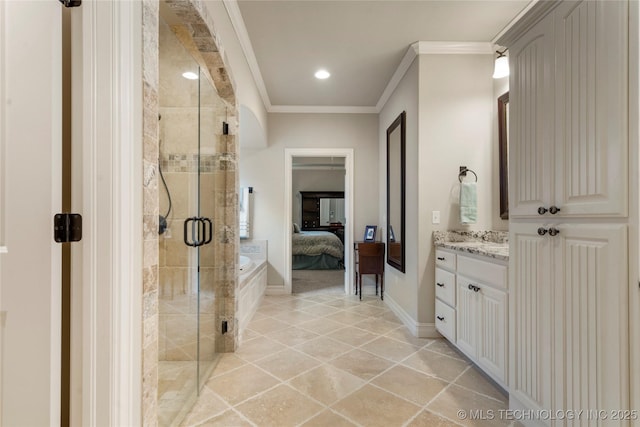 ensuite bathroom featuring a stall shower, vanity, crown molding, baseboards, and tile patterned flooring