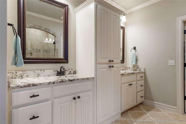 full bath with ornamental molding, two vanities, a tile shower, and baseboards