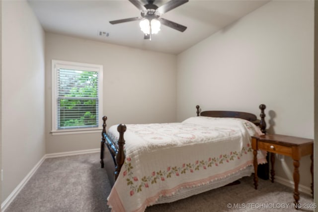 carpeted bedroom with baseboards and a ceiling fan