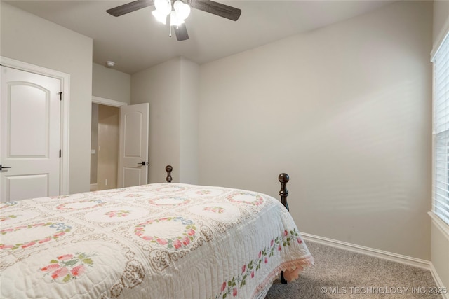 bedroom with carpet, baseboards, and a ceiling fan