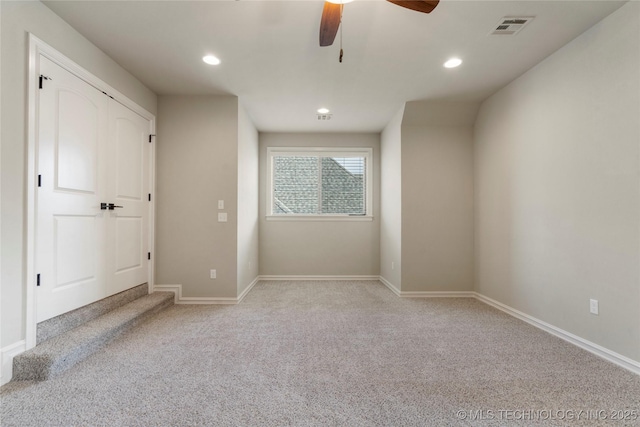 unfurnished bedroom featuring light colored carpet, recessed lighting, baseboards, and ceiling fan