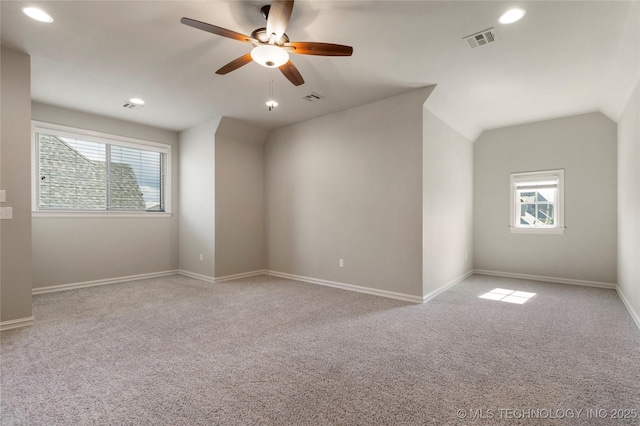 unfurnished room featuring healthy amount of natural light, carpet floors, ceiling fan, recessed lighting, and lofted ceiling