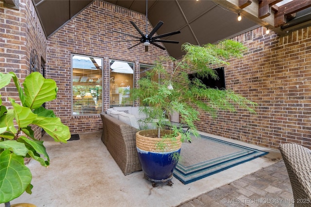 view of patio / terrace with ceiling fan and an outdoor living space