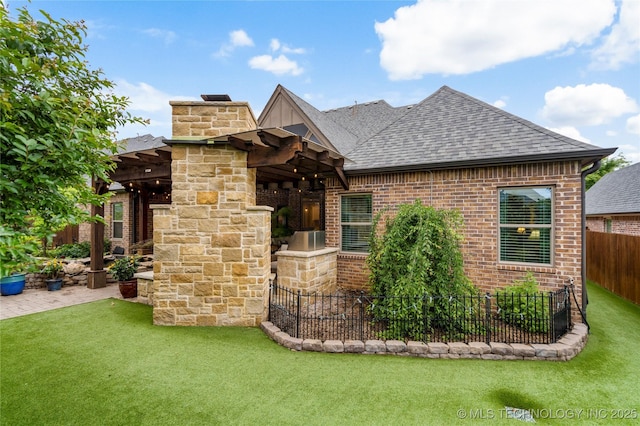view of front of home with a shingled roof, a chimney, and brick siding