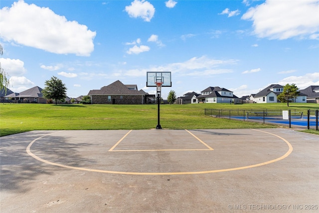 view of sport court with community basketball court and a residential view