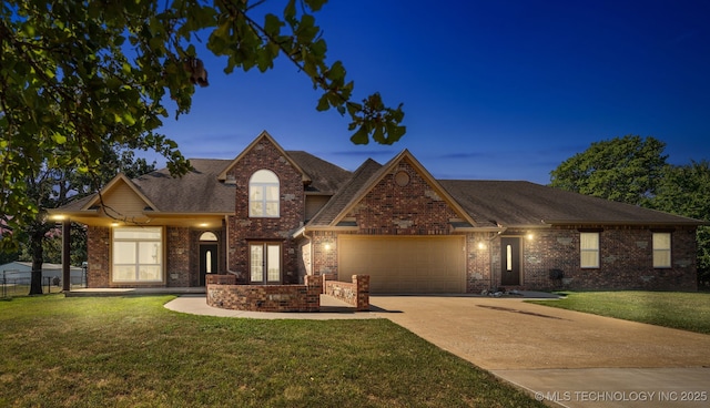 traditional-style house with an attached garage, brick siding, concrete driveway, and a shingled roof